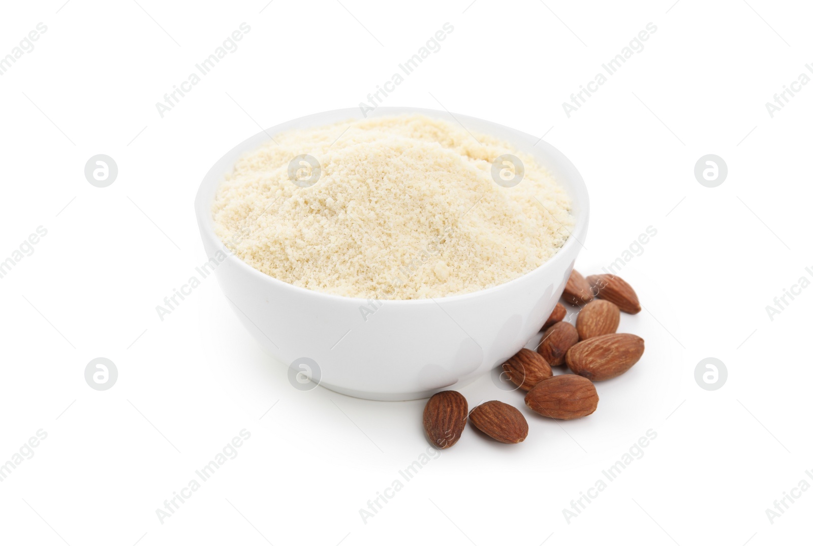 Photo of Bowl with almond flour and nuts on white background