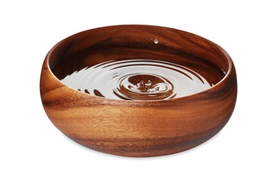 Photo of Wooden bowl full of water isolated on white