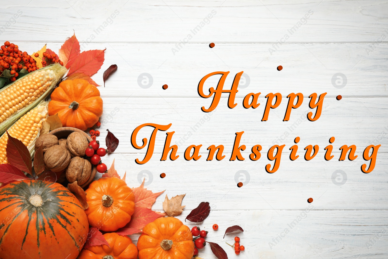 Image of Happy Thanksgiving Day card. Flat lay composition with vegetables, berries and autumn leaves on white wooden table