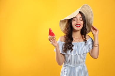 Beautiful young woman with watermelon on yellow background. Space for text