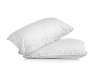 Clean soft bed pillows on white background