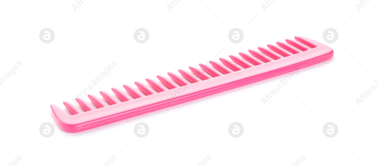 Photo of New pink hair comb isolated on white