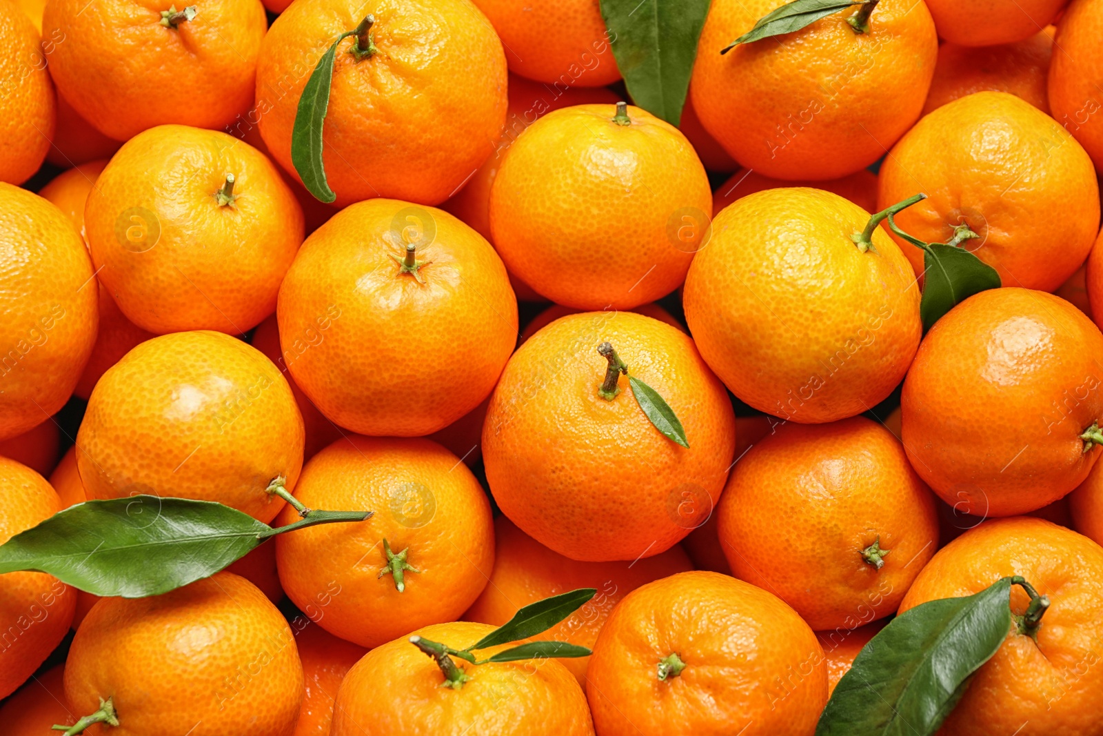 Photo of Delicious fresh ripe tangerines as background, top view