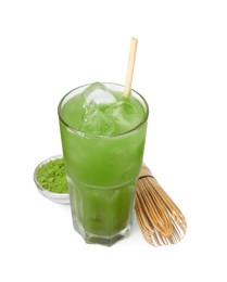 Photo of Glass of delicious iced green matcha tea, powder and bamboo whisk isolated on white