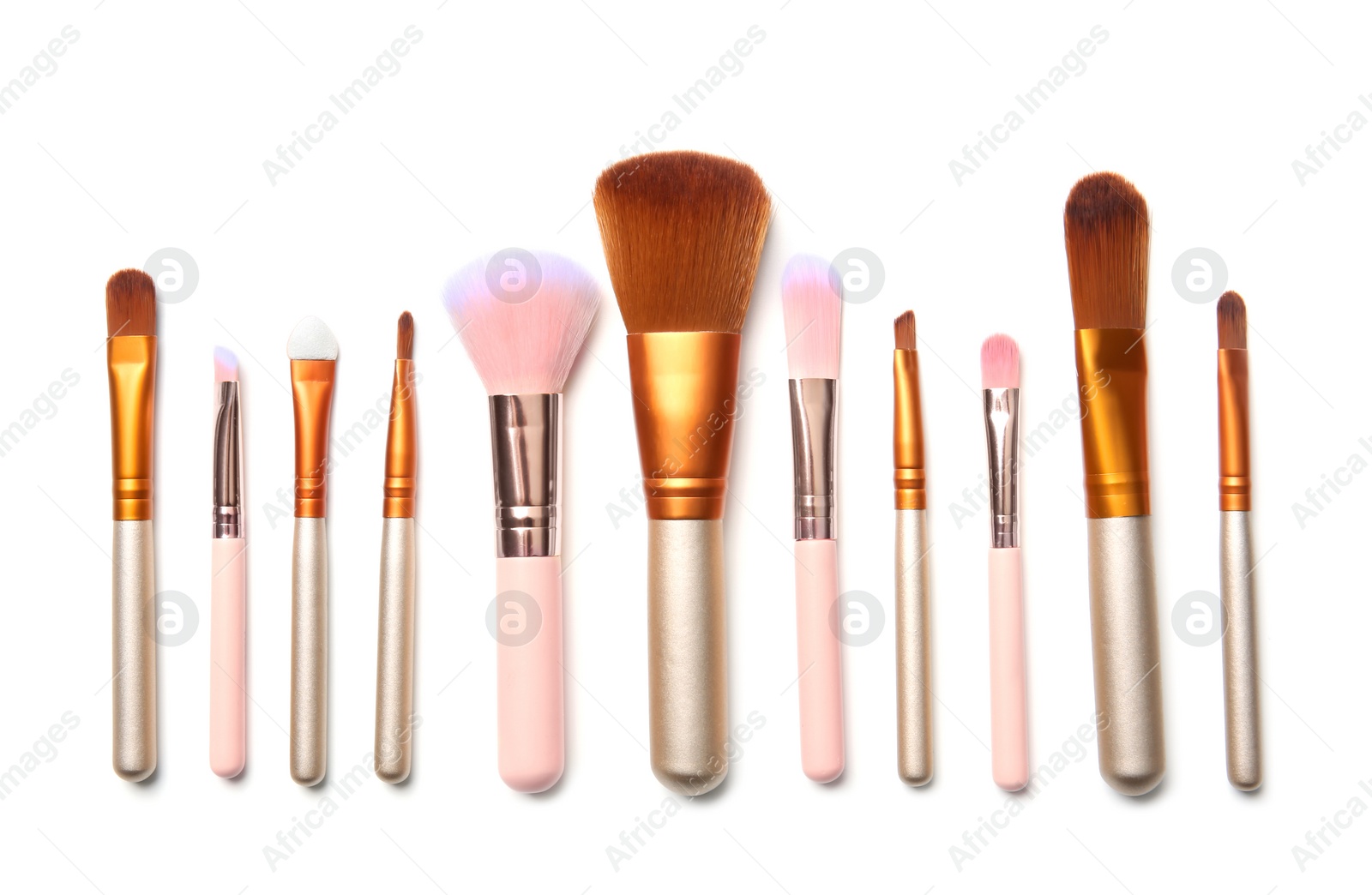 Photo of Flat lay composition with makeup brushes of professional artist on white background