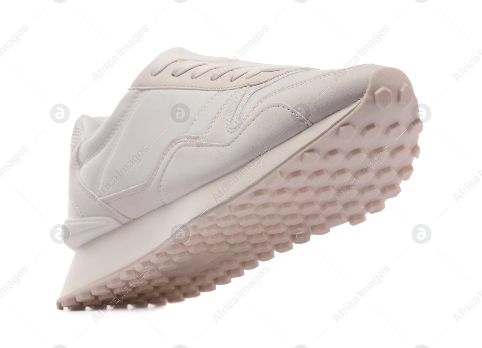 Photo of One stylish new sneaker isolated on white