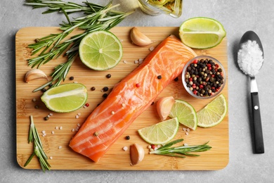 Photo of Fresh salmon and ingredients for marinade on table, top view