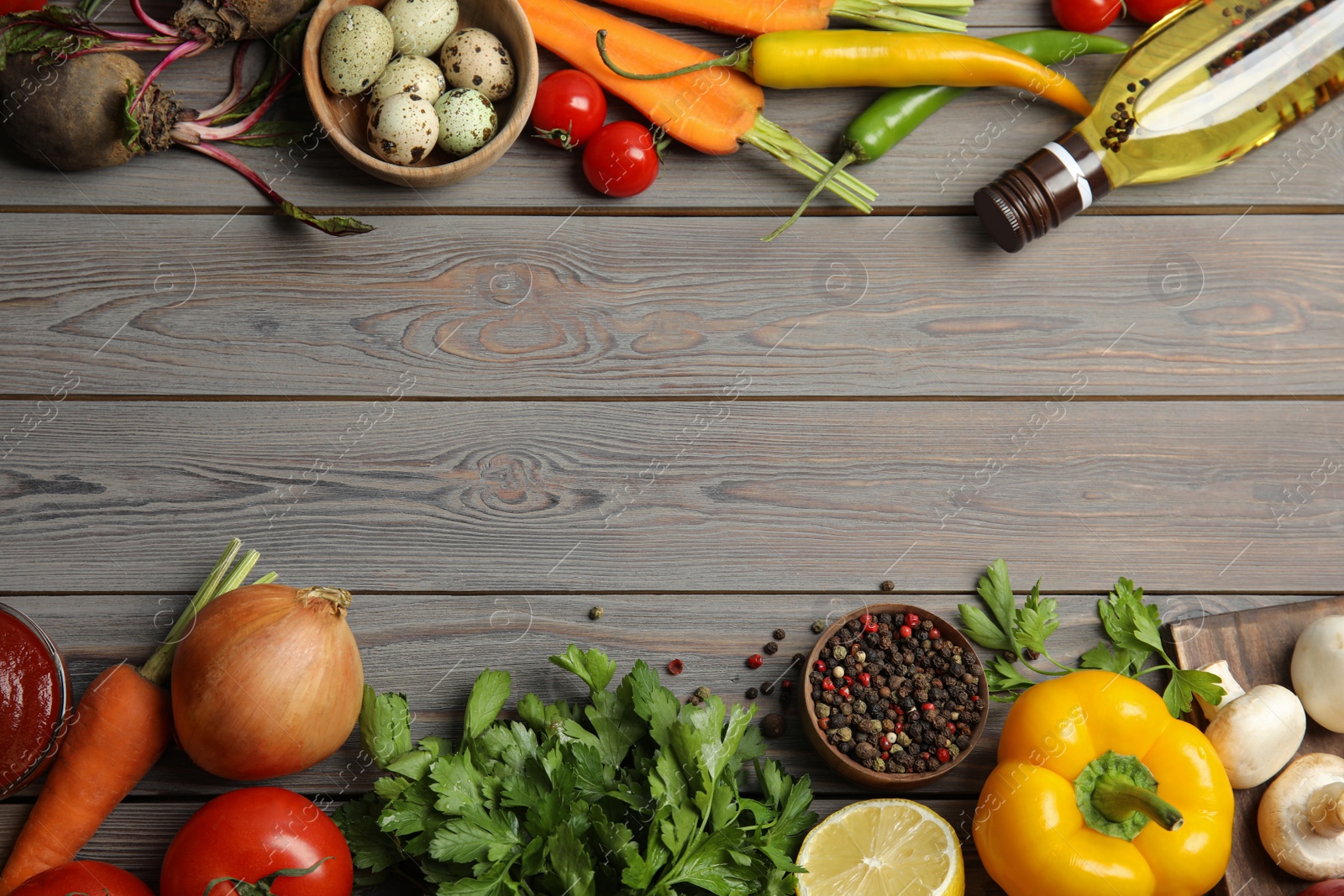 Photo of Flat lay composition with ingredients for cooking on wooden table. Space for text