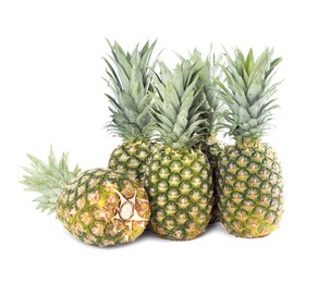 Photo of Many delicious ripe pineapples on white background