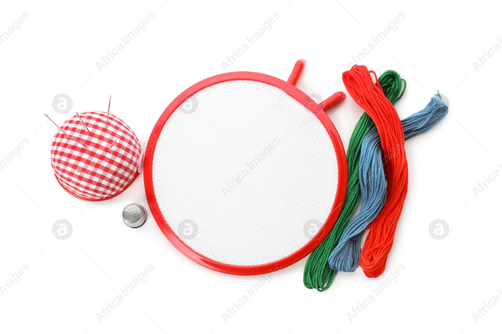 Photo of Set of embroidery equipment on white background, top view