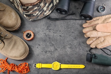 Flat lay composition with camping equipment on grey background