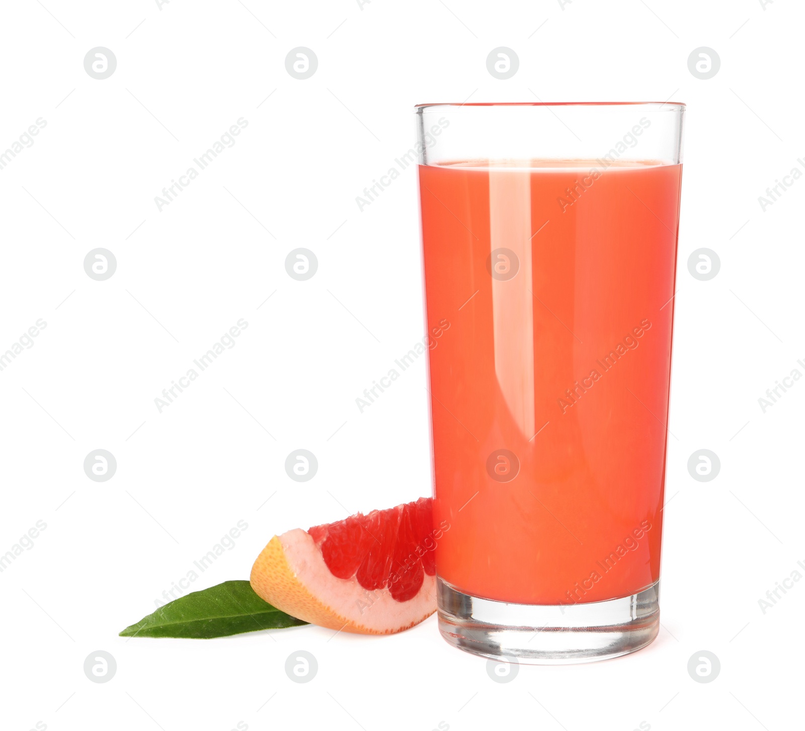 Photo of Tasty grapefruit juice in glass, fresh fruit and green leaf isolated on white