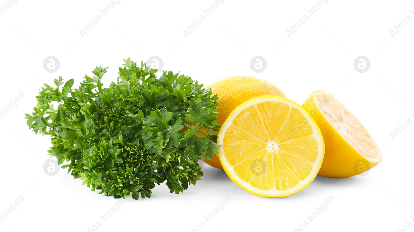 Photo of Green fresh parsley with lemons on white background