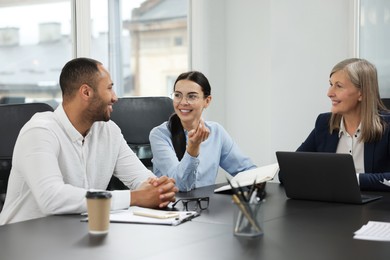 Lawyers working together at table in office