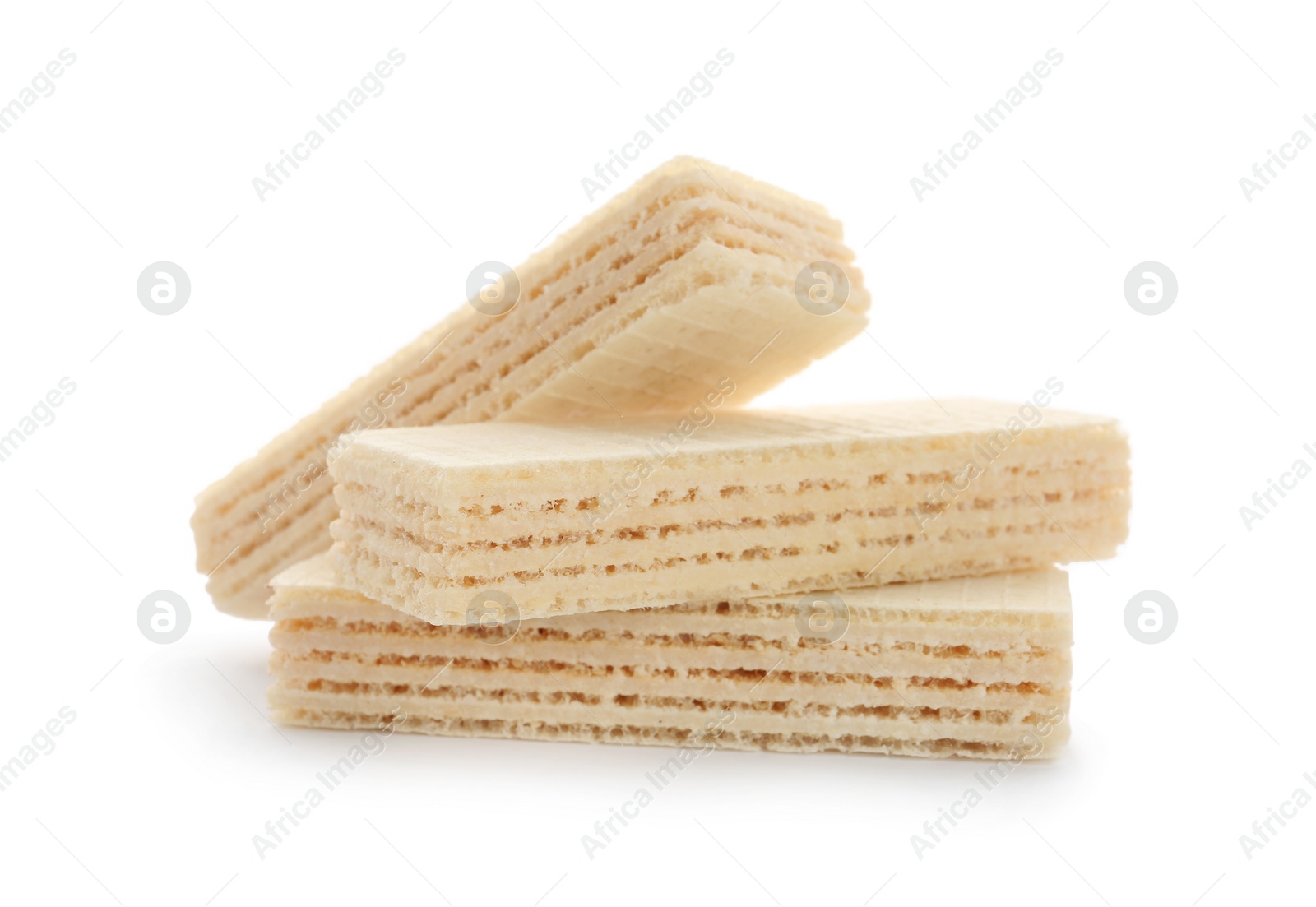 Photo of Delicious crispy wafers on white background. Sweet food