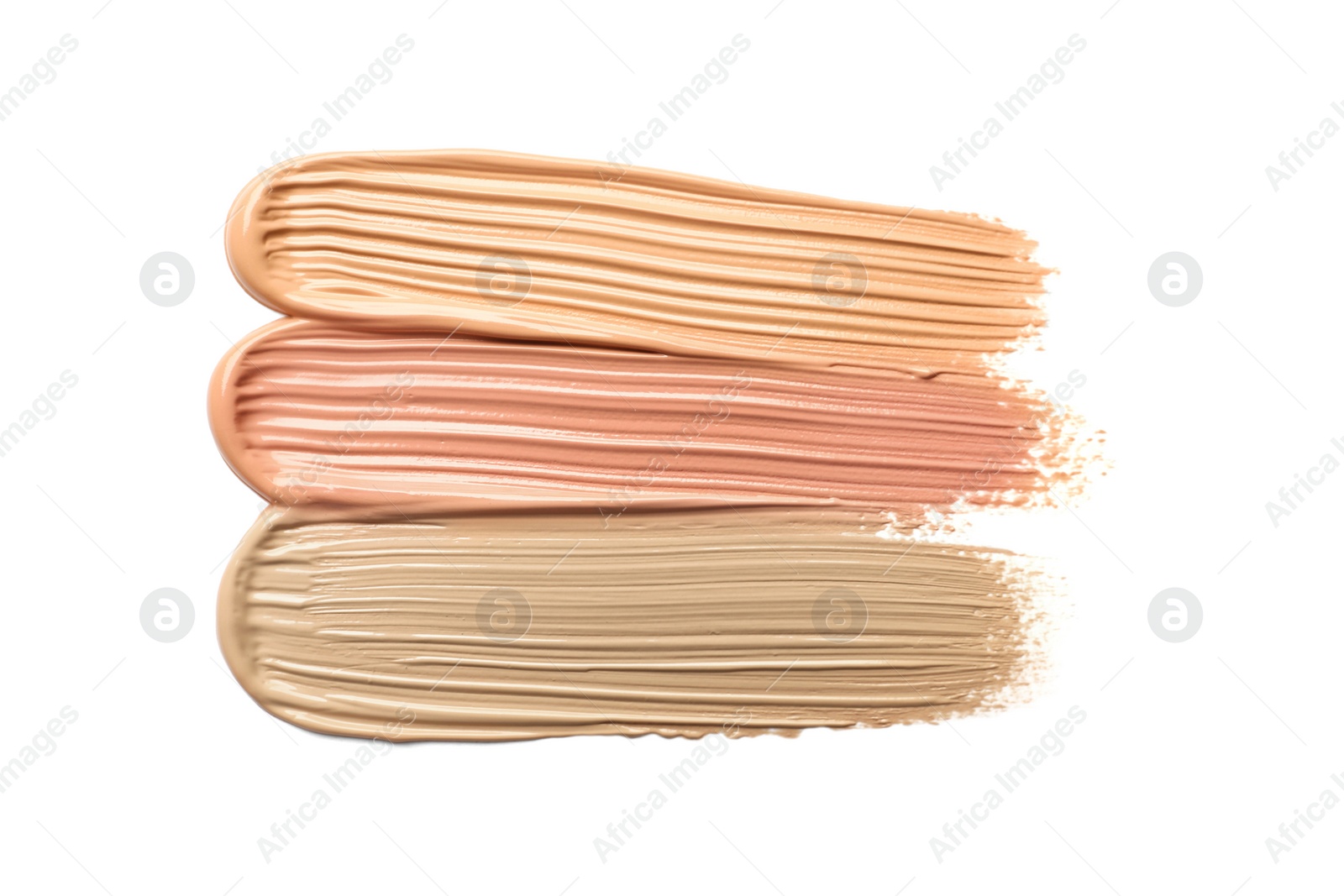 Image of Different shades of liquid foundation on white background, top view