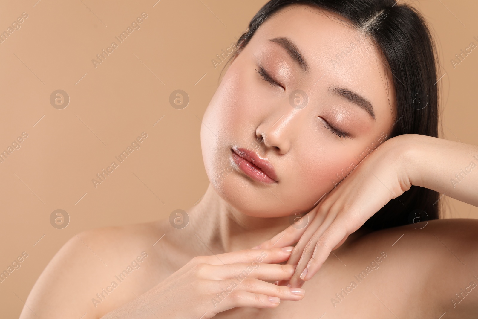 Photo of Beautiful woman with healthy skin on beige background, space for text