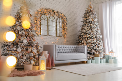 Photo of Beautiful interior of living room with decorated Christmas trees