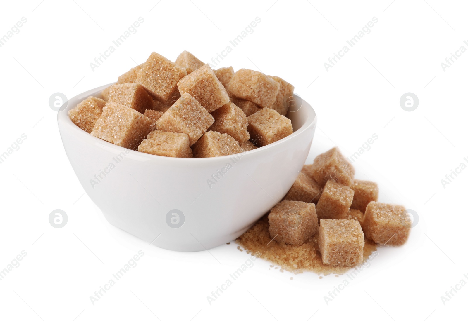 Photo of Bowl and brown sugar cubes on white background