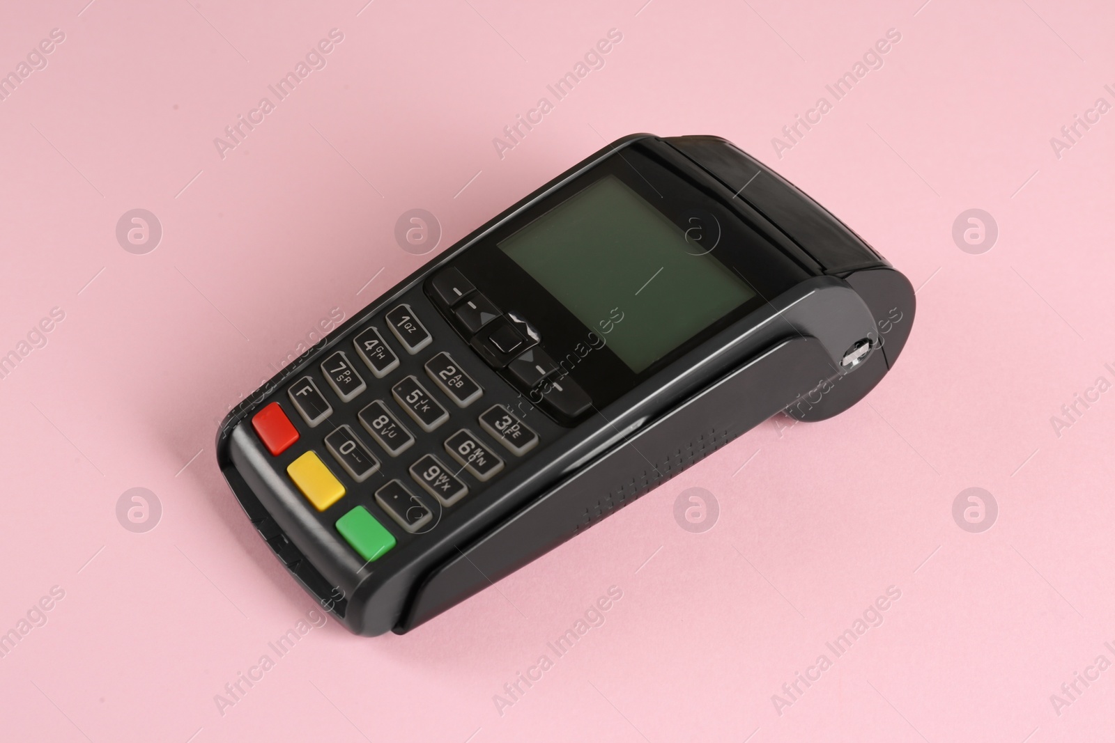 Photo of New modern payment terminal on pink background
