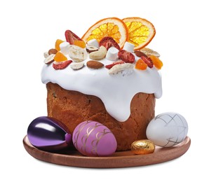 Traditional Easter cake with dried fruits and decorated eggs isolated on white