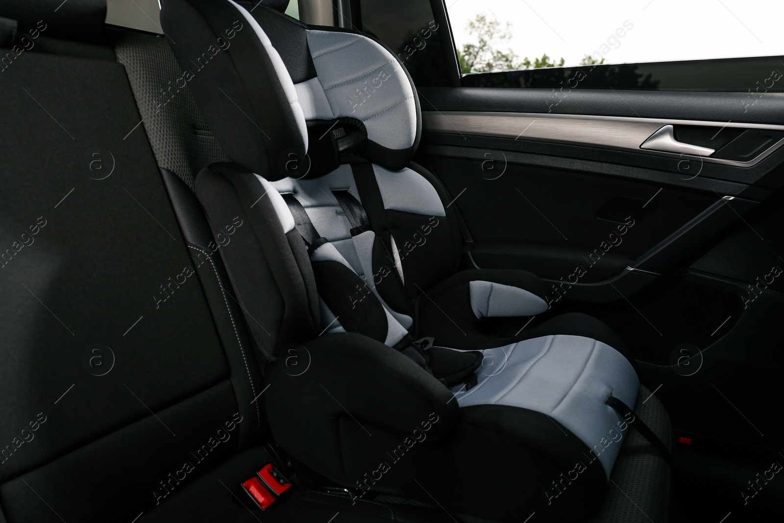 Photo of Empty modern child safety seat in car