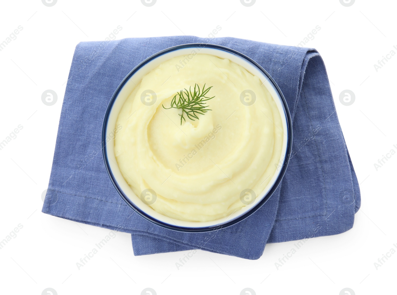 Photo of Bowl with freshly cooked homemade mashed potatoes and napkin isolated on white, top view
