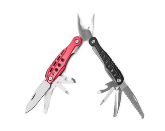 Photo of Red and black compact portable multitool isolated on white