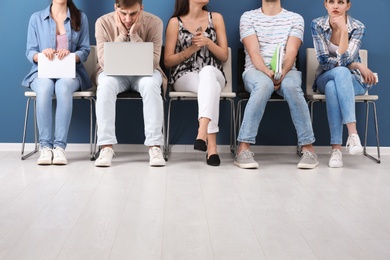 Group of people waiting for job interview, indoors