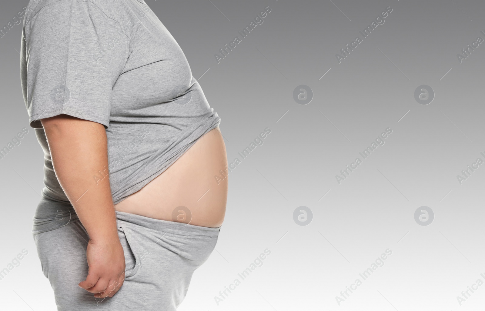 Image of Closeup view of overweight man on light grey background, space for text