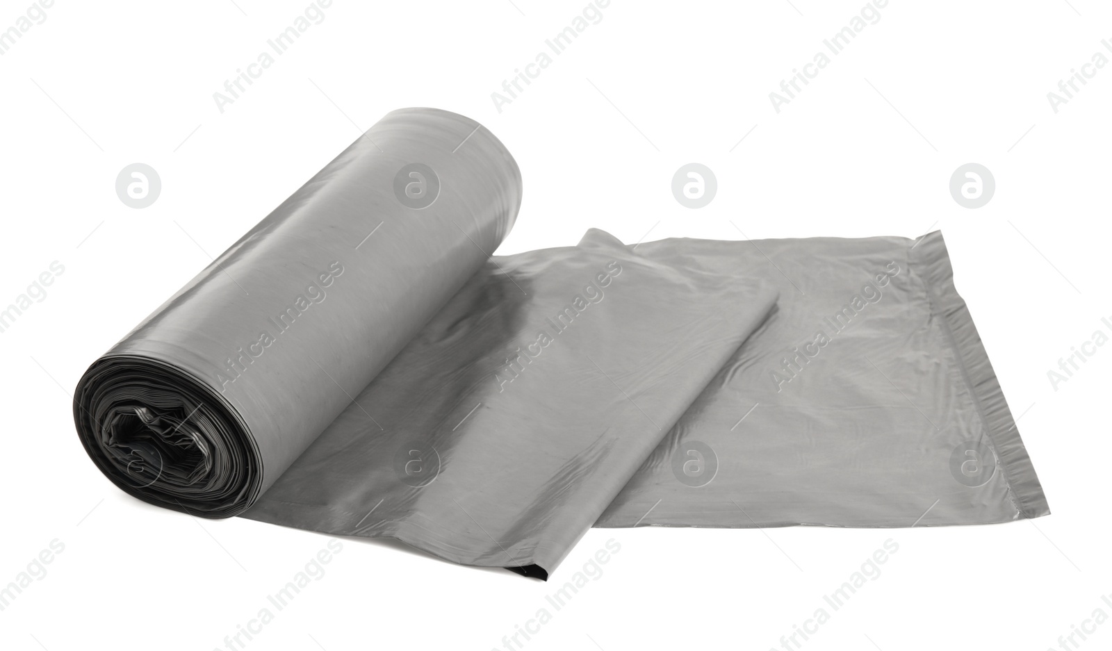 Photo of Roll of grey garbage bags on white background. Cleaning supplies