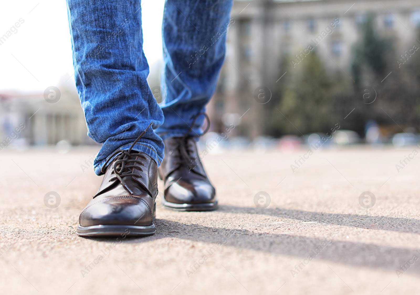 Photo of Man in elegant leather shoes outdoors, closeup