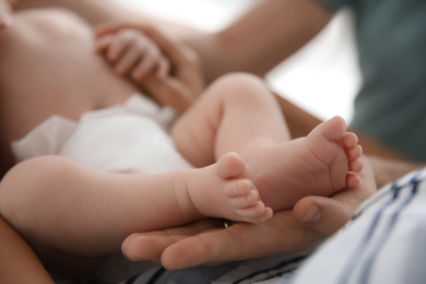 Photo of Couple with their newborn baby, closeup view