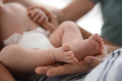 Couple with their newborn baby, closeup view