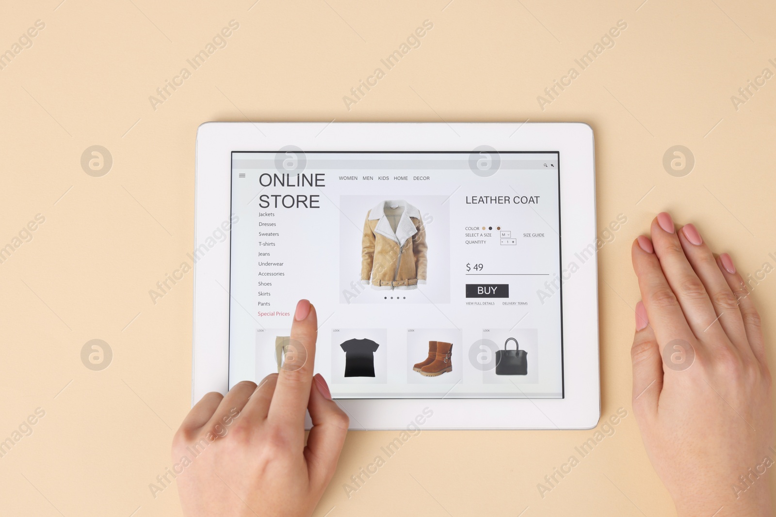 Photo of Woman with tablet shopping online on beige background, top view