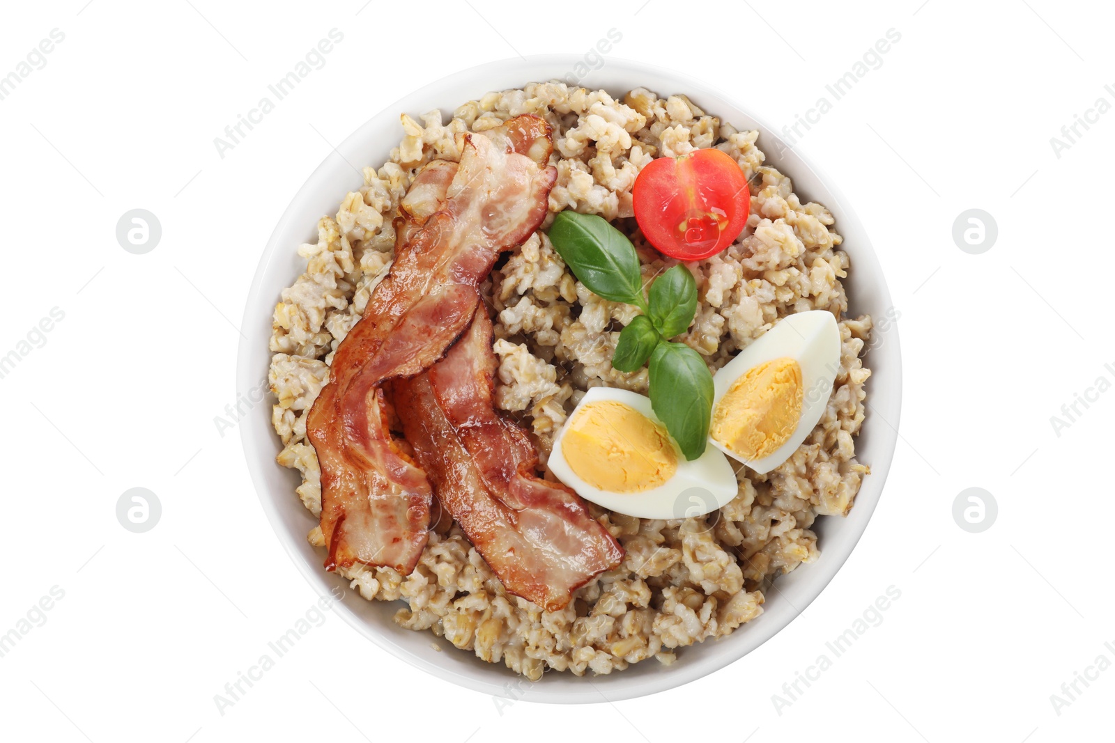 Photo of Tasty boiled oatmeal with egg, bacon and tomatoes isolated on white, top view
