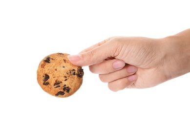 Photo of Woman holding tasty chocolate chip cookie on white background, closeup