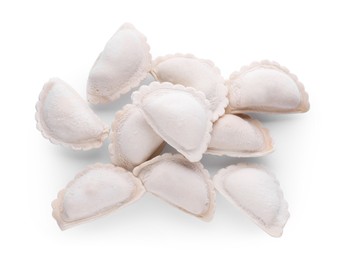 Pile of raw dumplings (varenyky) on white background, top view