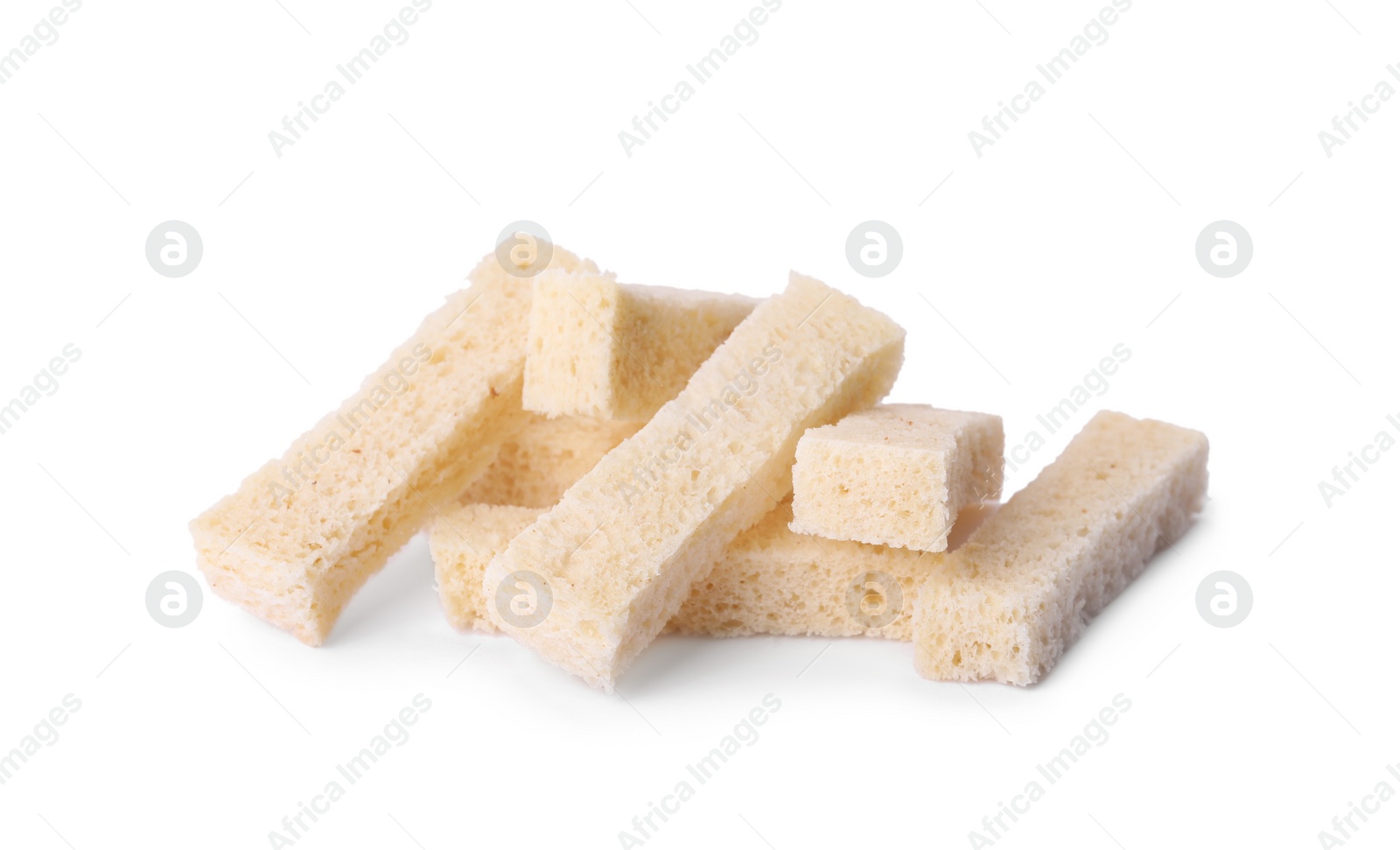 Photo of Heap of crispy rusks on white background