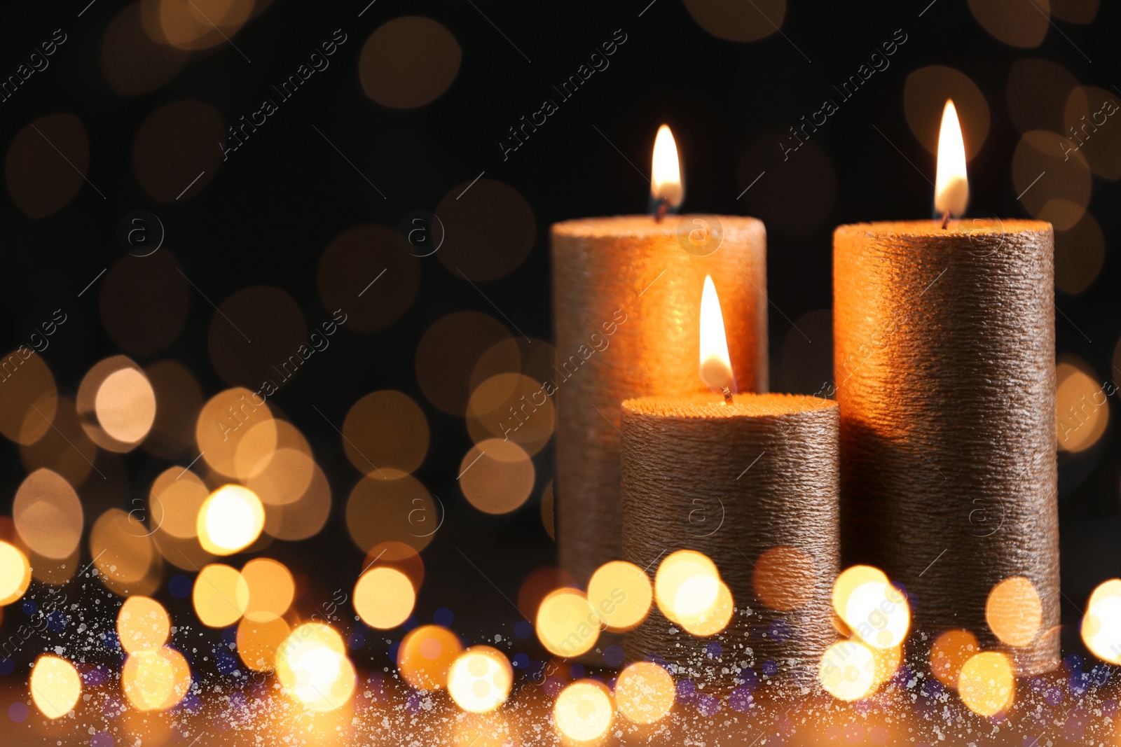 Image of Burning candles on dark background, bokeh effect