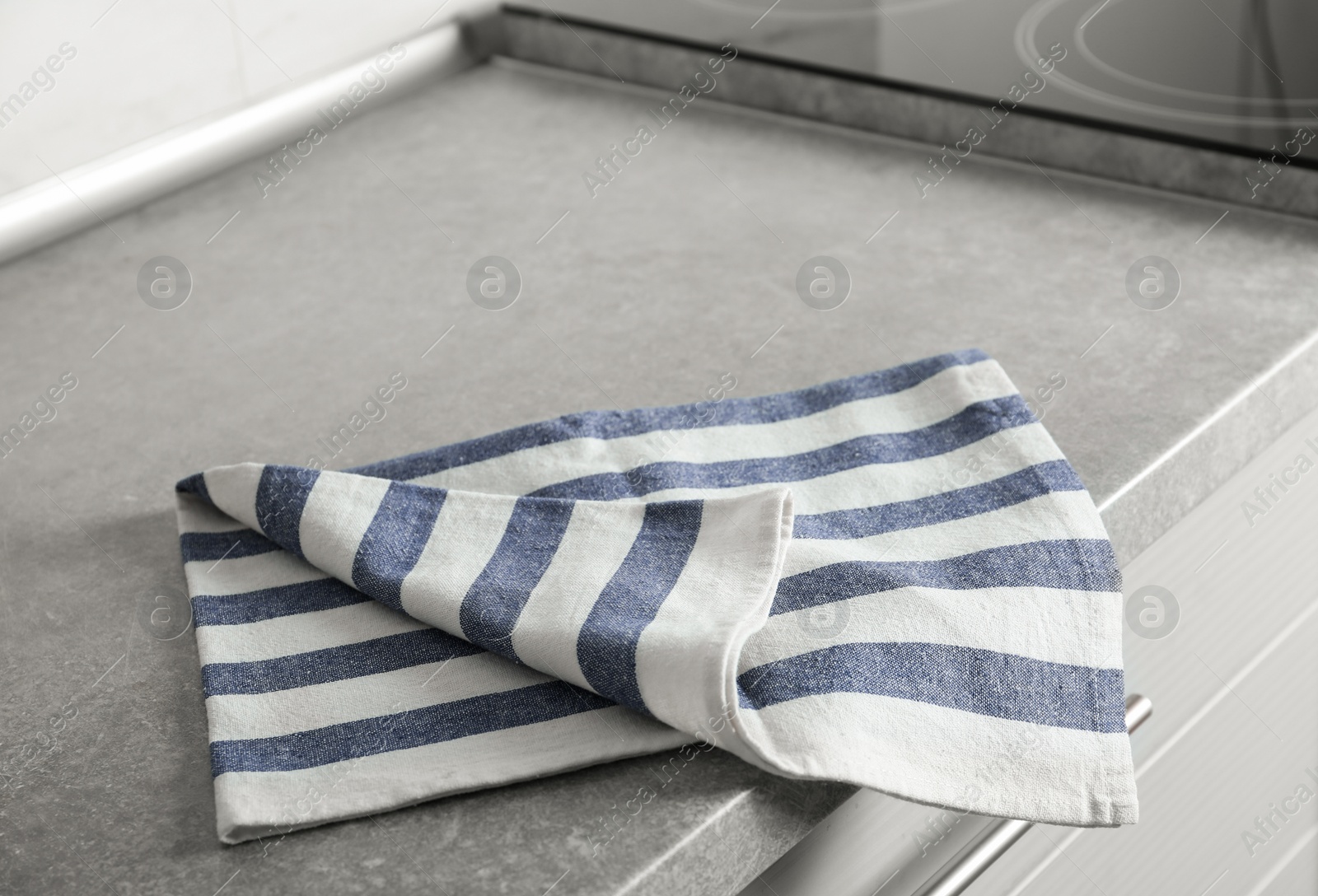 Photo of Striped cotton towel on countertop in kitchen