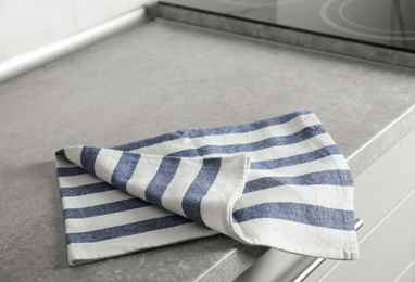Photo of Striped cotton towel on countertop in kitchen