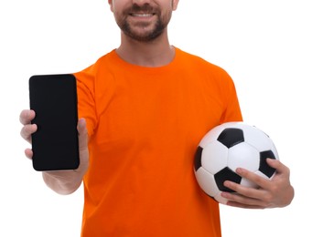 Sports fan with ball and smartphone on white background, closeup