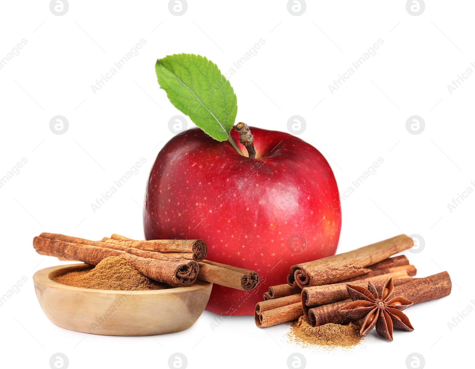 Image of Aromatic cinnamon sticks, powder, anise star and red apple isolated on white