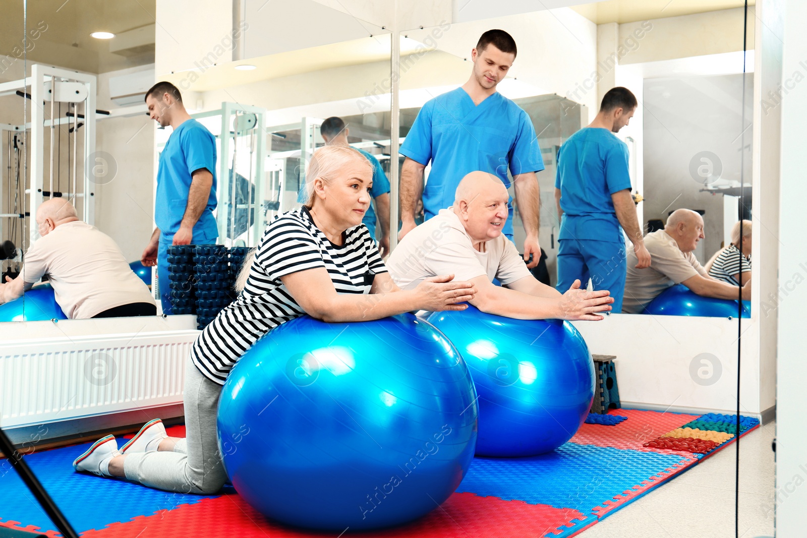 Photo of Patients exercising under physiotherapist supervision in rehabilitation center