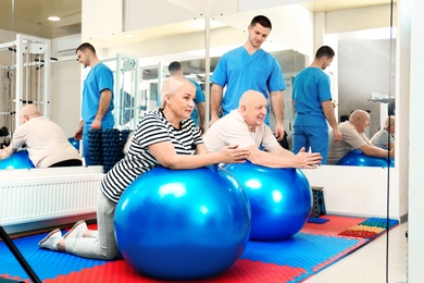 Photo of Patients exercising under physiotherapist supervision in rehabilitation center