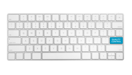 Modern computer keyboard and quality control button isolated on white, top view  