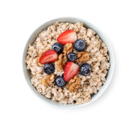 Photo of Tasty oatmeal with strawberries, blueberries and walnuts in bowl isolated white, top view