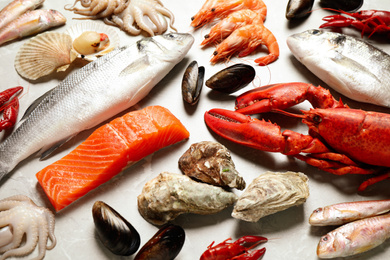 Fresh fish and seafood on marble table