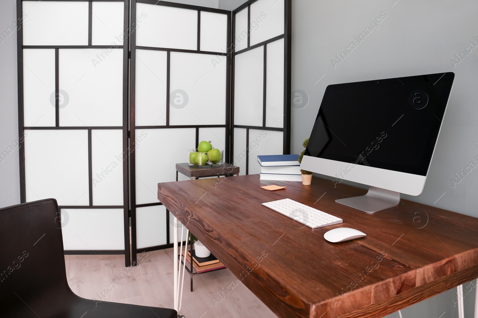 Photo of Comfortable workplace with computer on desk in home office